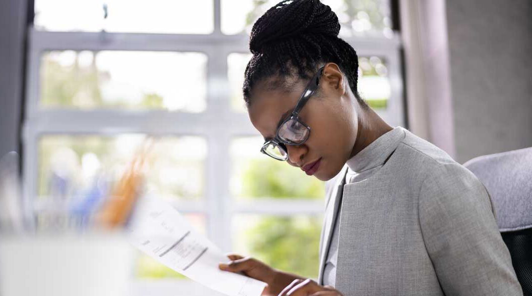 A women studying financial documents
