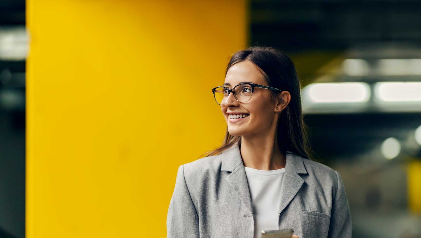 A woman smiling away from the camera
