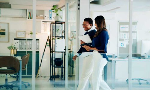 2 businesswomen walking