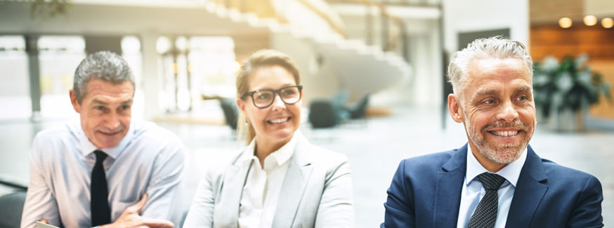 A group of business people looking at a presentation